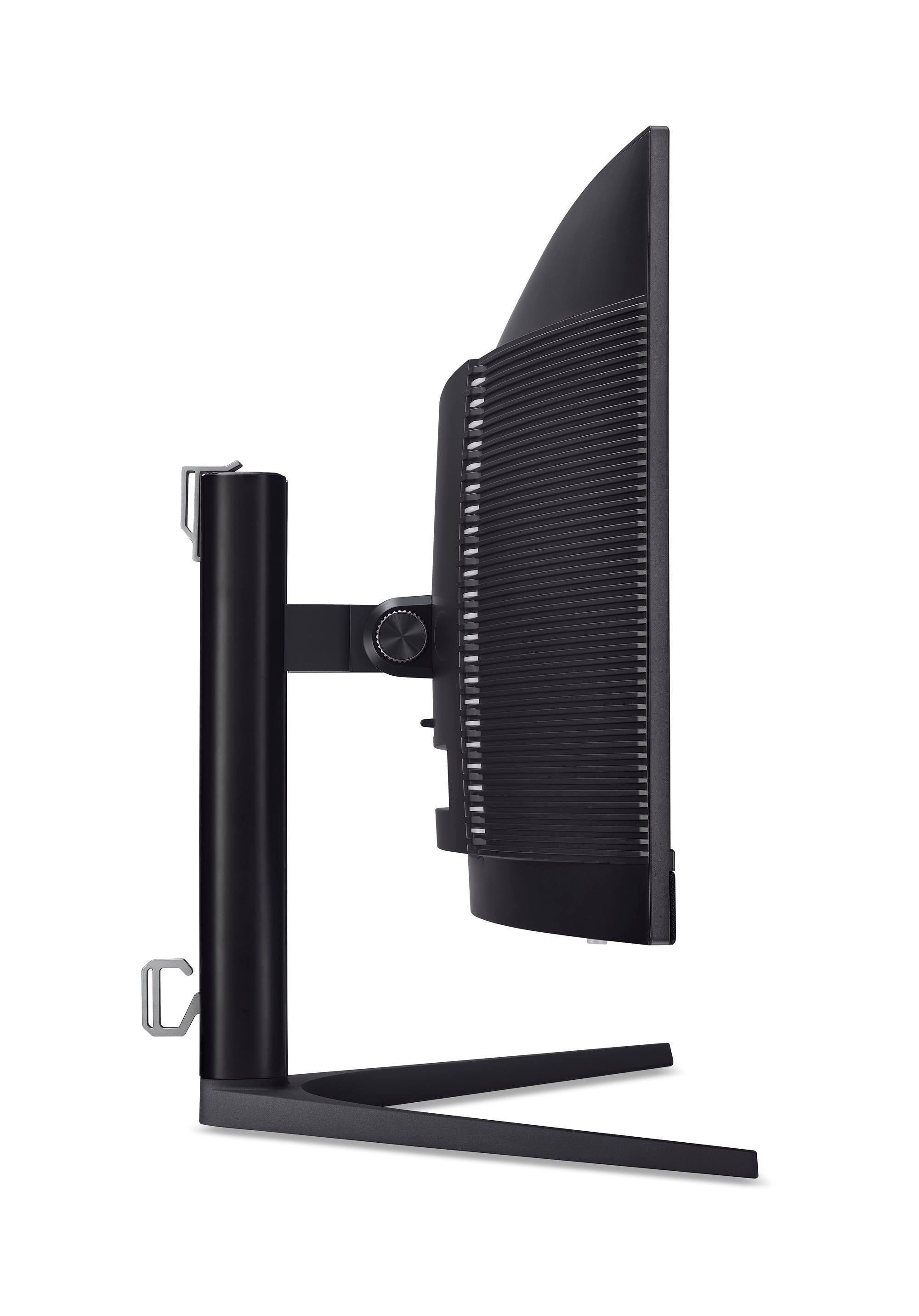 Widok z boku czarnego monitora z podstawą. Białe tło.