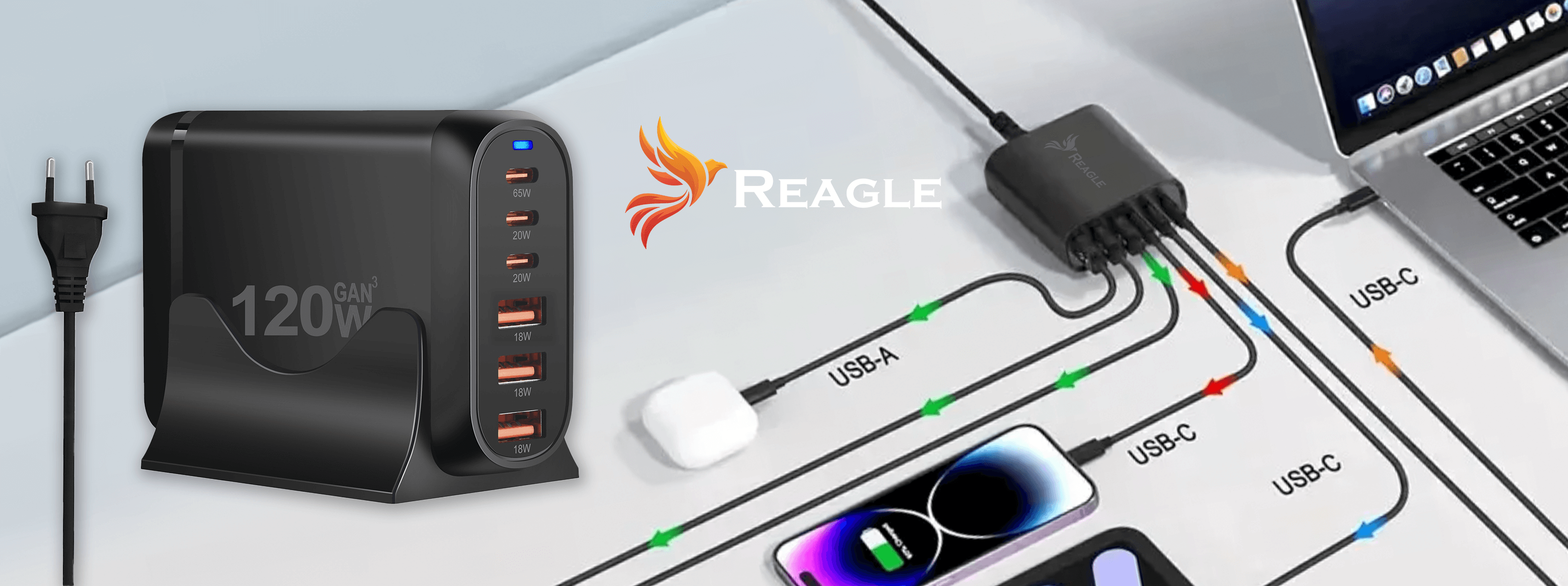 Obraz przedstawiający czarny zasilacz i wieloportową stację ładującą z laptopem i telefonami.