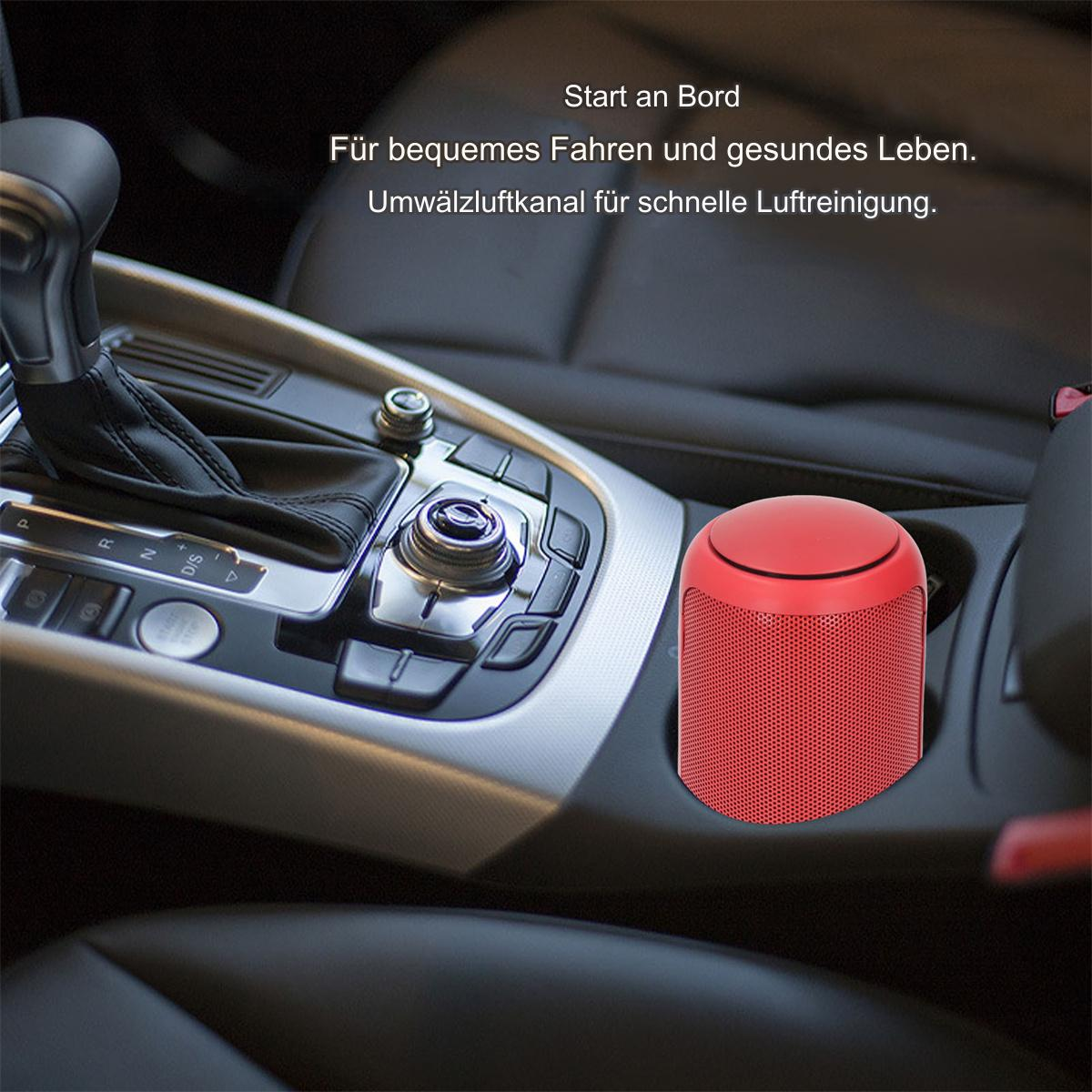 Ein roter Auto-Luftreiniger in einem Getränkehalter eines Autos, in der Nähe des Schalthebels.