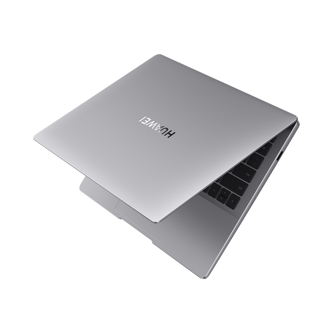 Srebrny laptop z góry. Ekran jest lekko otwarty, pokazując klawiaturę. Białe tło.