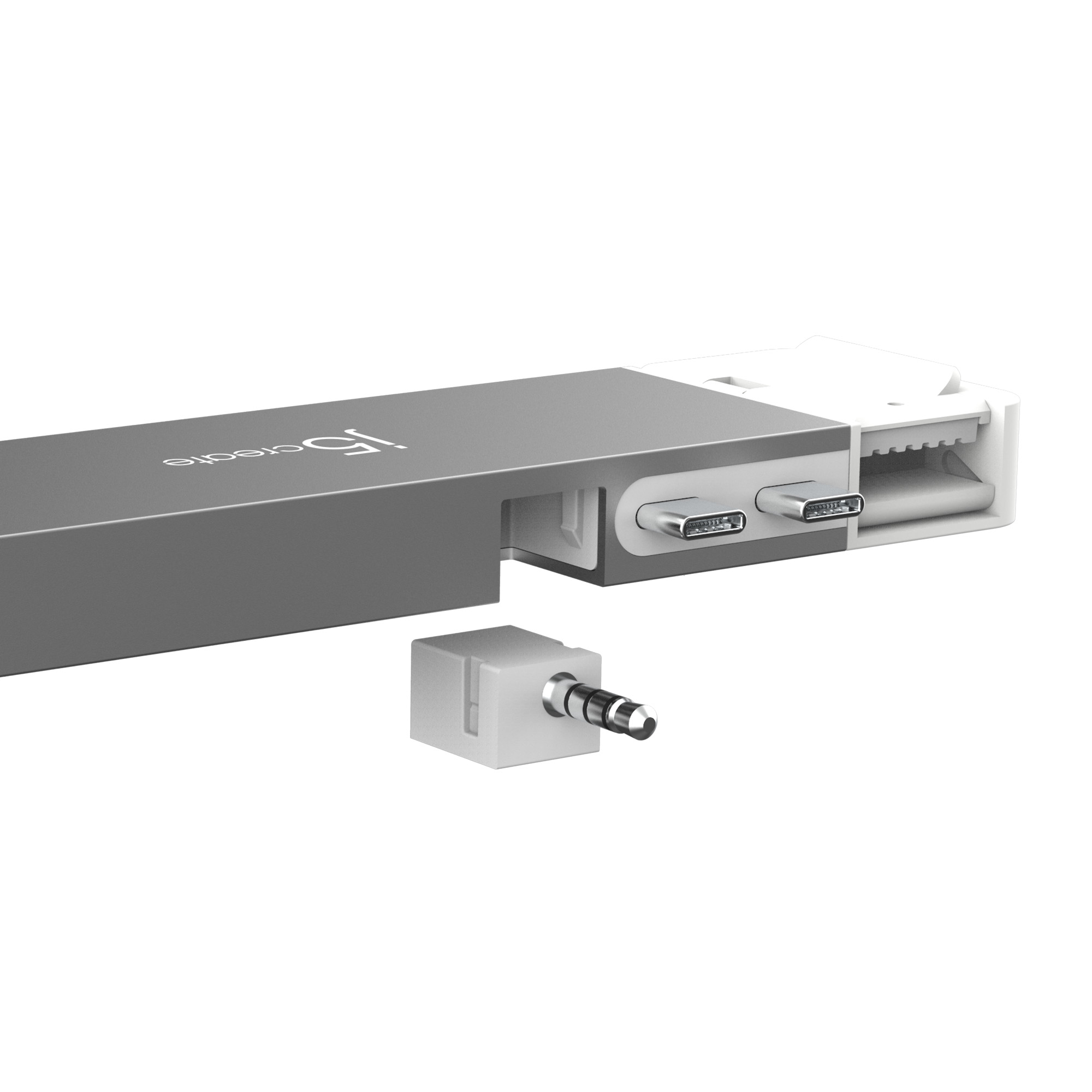 Silbernes Gerät mit USB-C-Anschlüssen. Abnehmbarer Adapter mit Klinke.