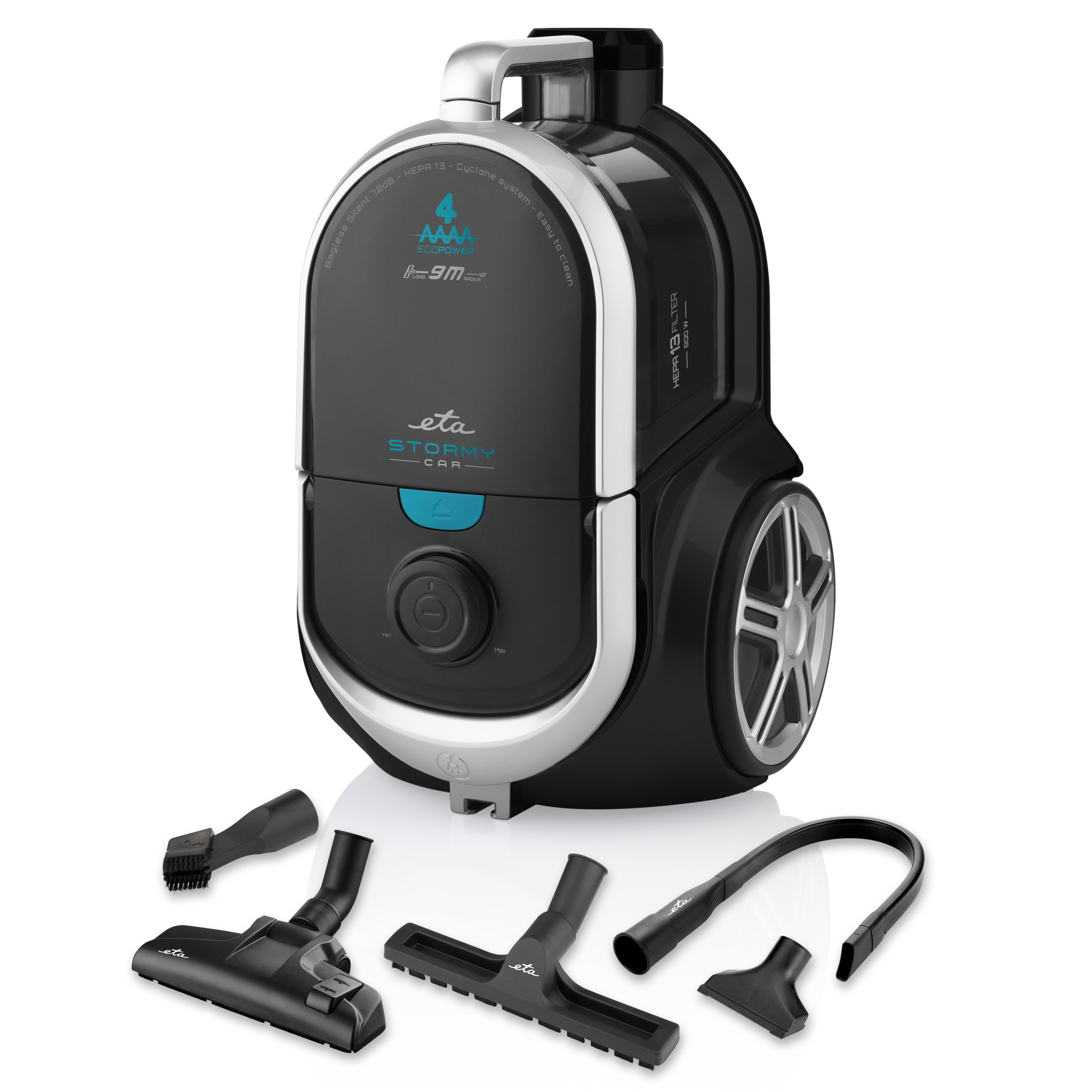 A black and silver vacuum cleaner with attachments on a white background. The vacuum cleaner has a handle.