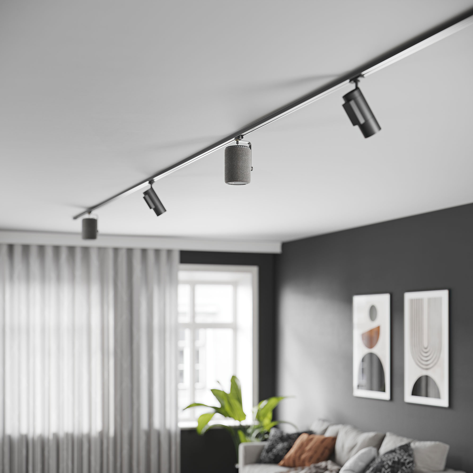 Plafond met railsysteemverlichting, drie lampen en uitzicht op een kamer met een bank.