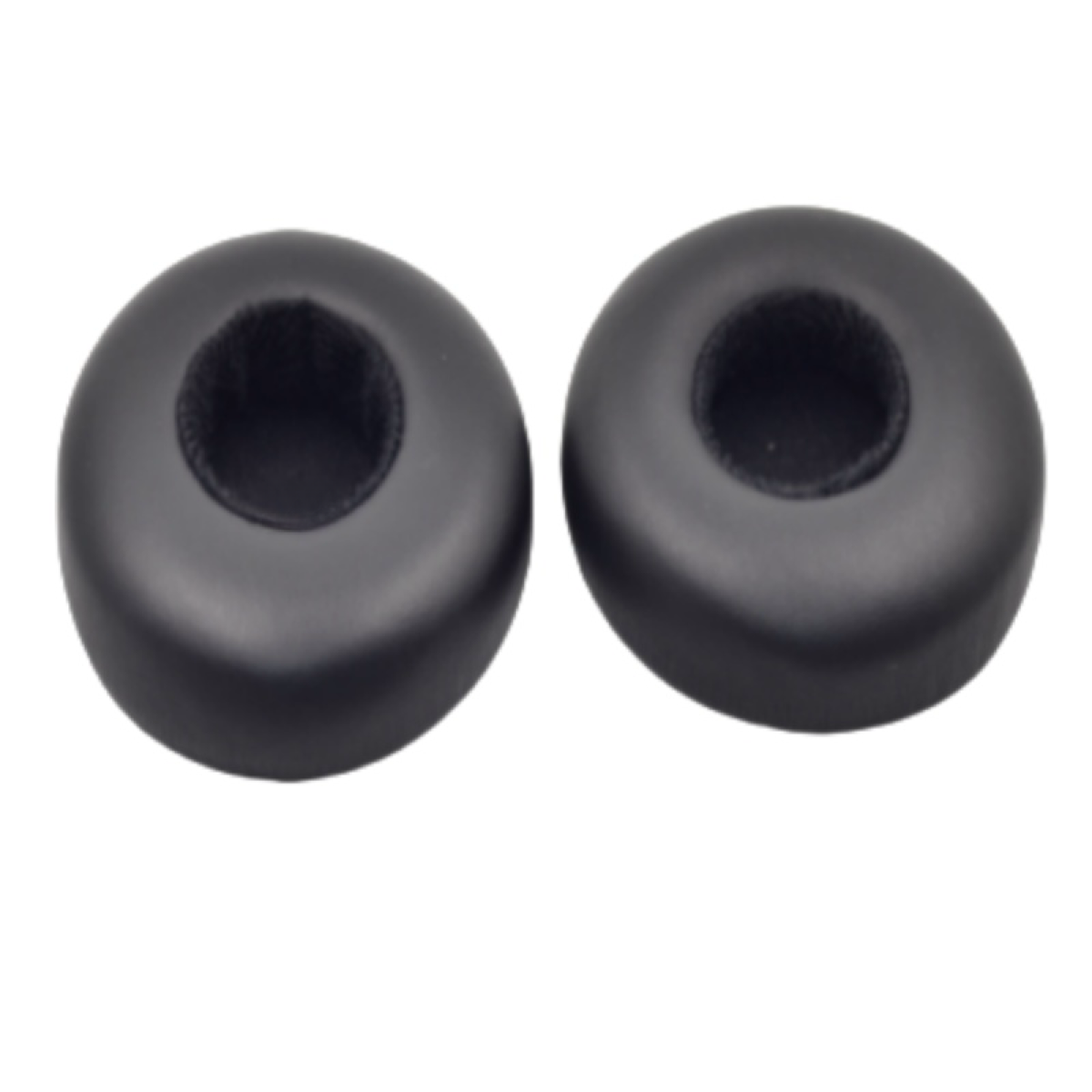 Dwie czarne, okrągłe wkładki douszne. Są okrągłe i mają otwór pośrodku.