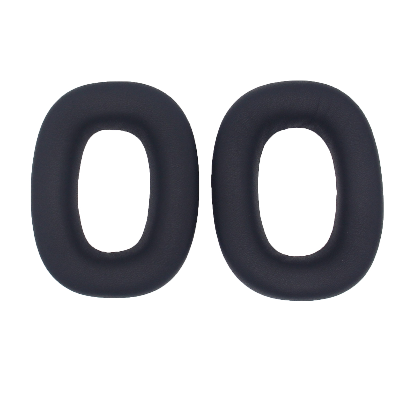 Dwie czarne, owalne nauszniki do słuchawek, na białym tle, z otworem pośrodku.