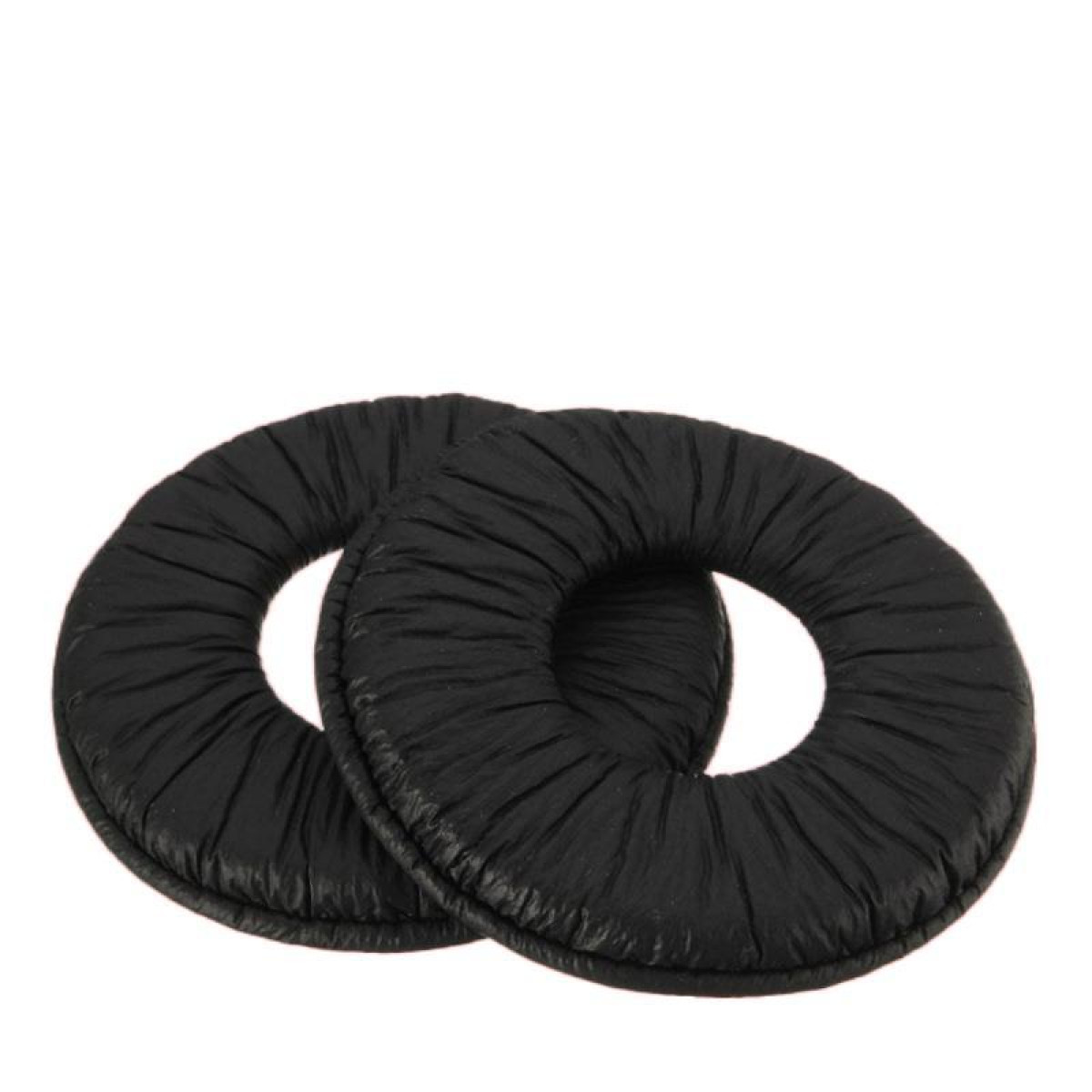 Dwie czarne, okrągłe poduszki na słuchawki. Są miękkie i mają żebrowaną fakturę.