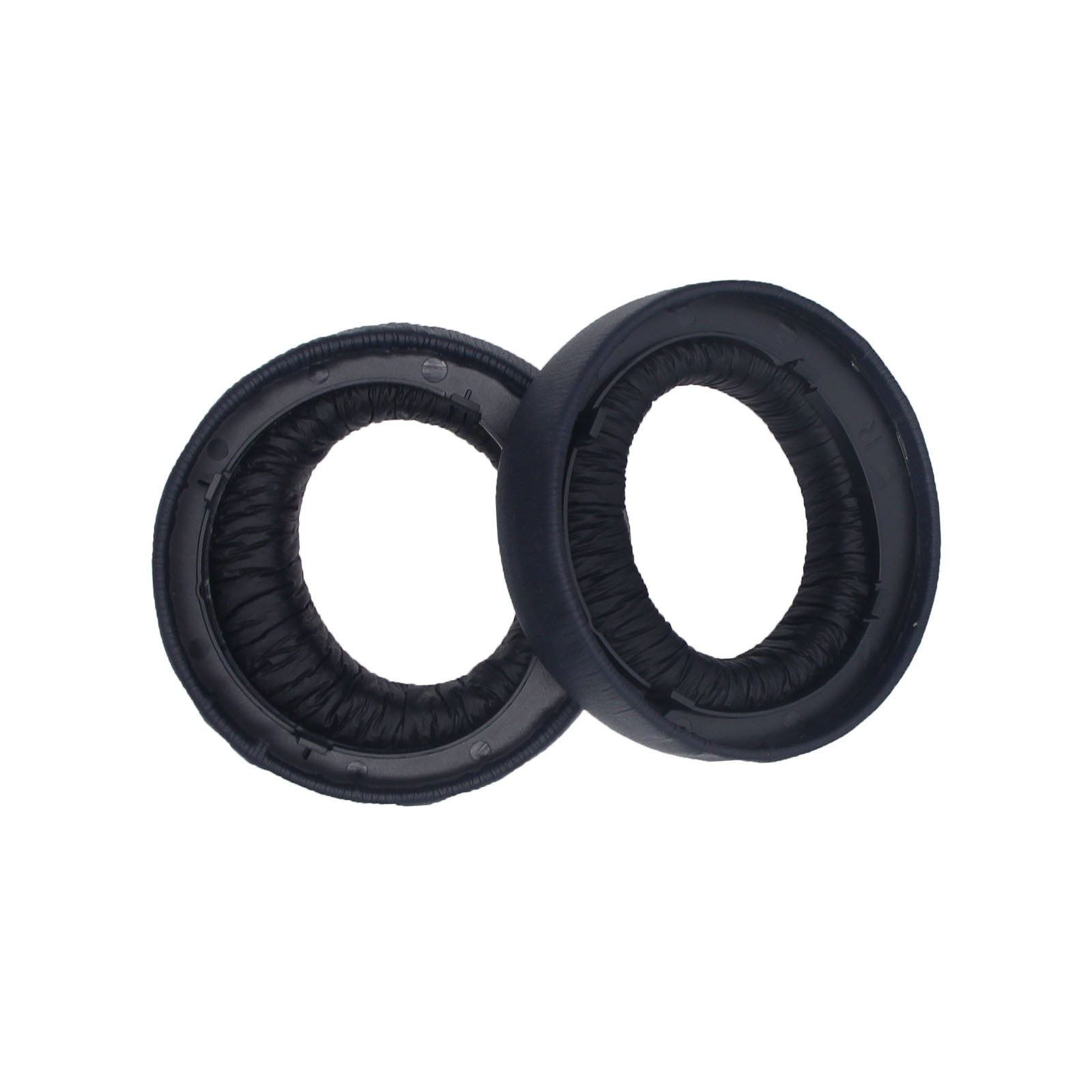 Dwie ciemnoniebieskie poduszki nauszne do słuchawek.