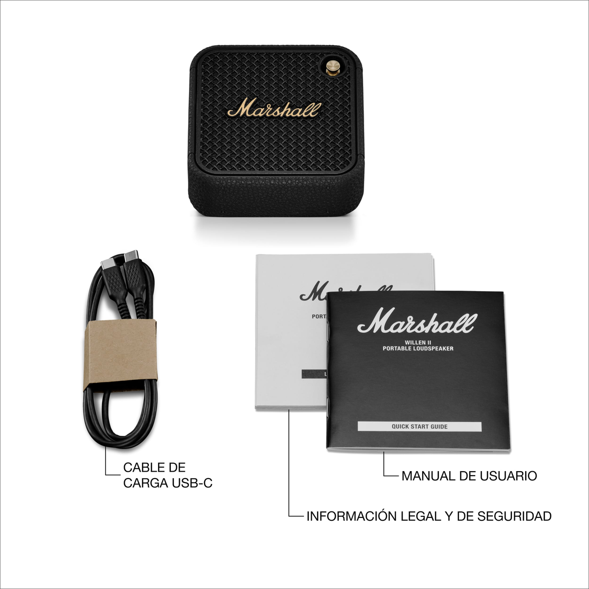 Altoparlante Marshall nero, cavo di ricarica e manuali su superficie bianca. Etichette in spagnolo.