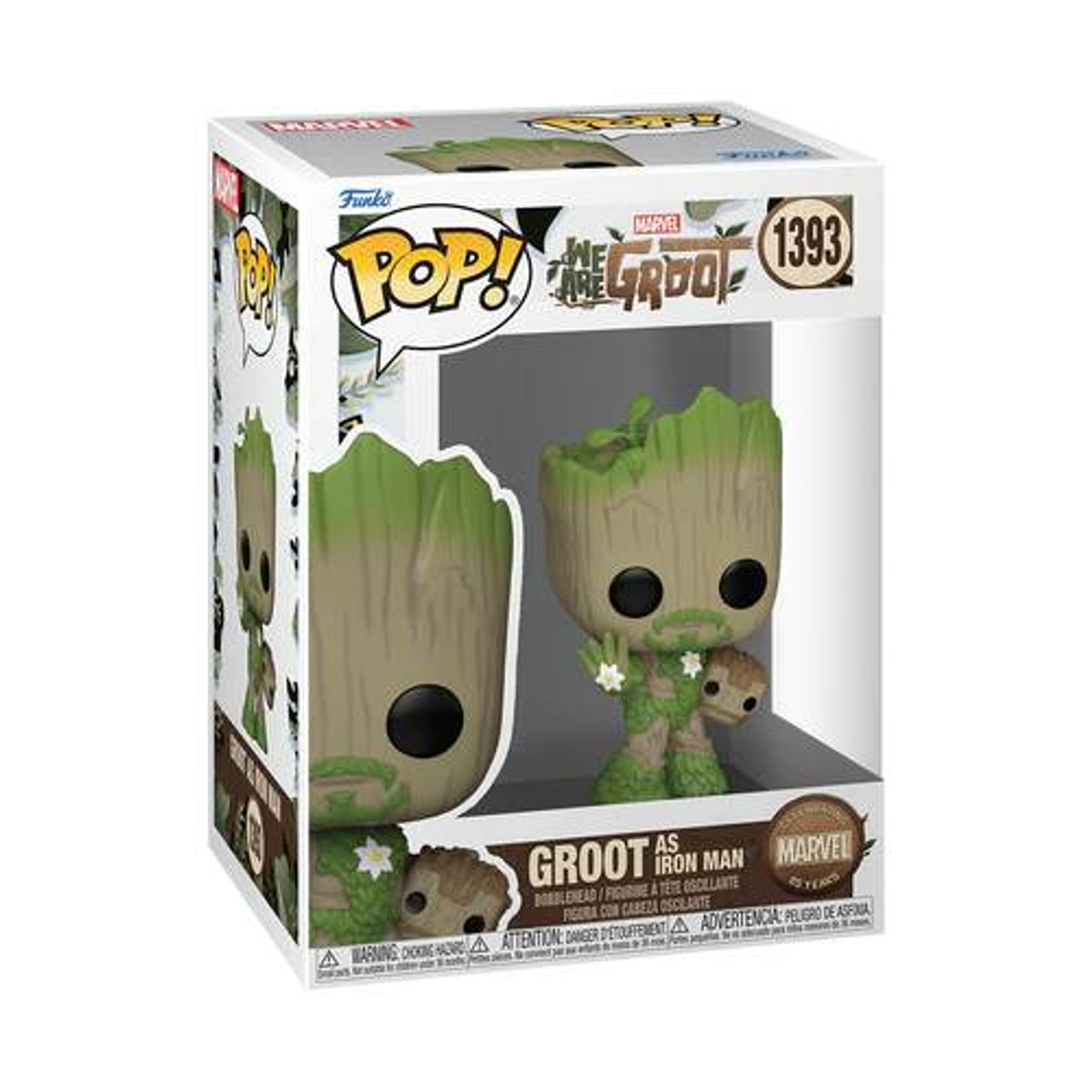 Eine Spielfigur einer baumartigen Kreatur in einer Box, mit Groot.