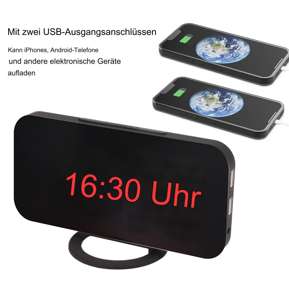 Eine schwarze Uhr, die 16:30 anzeigt, mit zwei ladenden Telefonen und einem schwarzen Ständer.