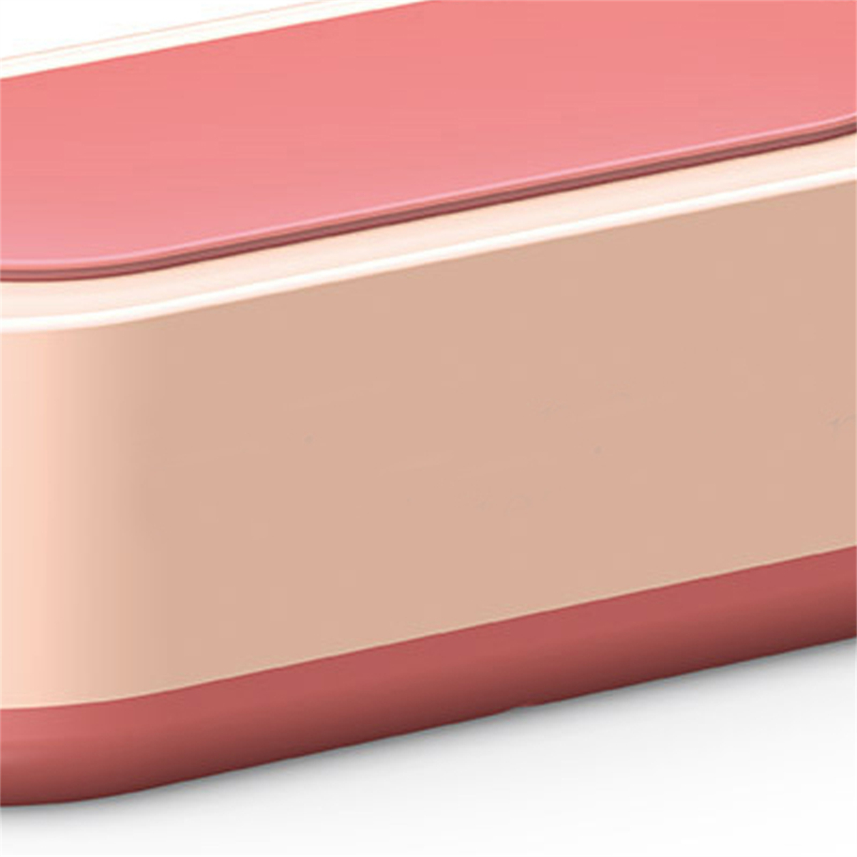 Nahaufnahme eines pinkfarbenen und beigefarbenen elektronischen Geräts.