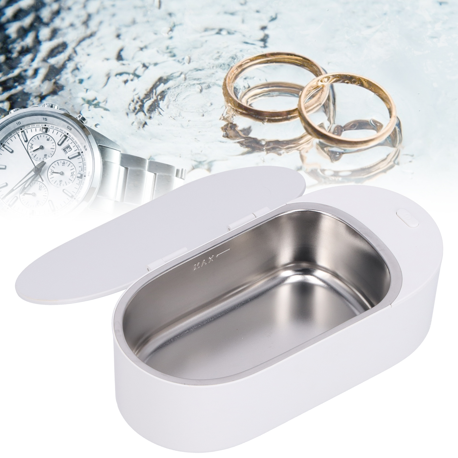 Ein Ultraschallreiniger mit Uhr und Ringen. Ein weißes Gerät, offen.