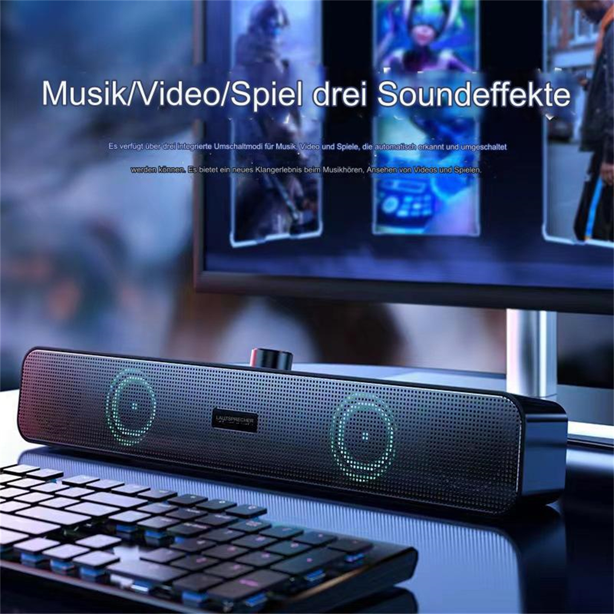 Schwarze Soundbar mit Lautsprechern, einem Knopf und einer Tastatur im Vordergrund. Ein Bildschirm mit Bildern dahinter.