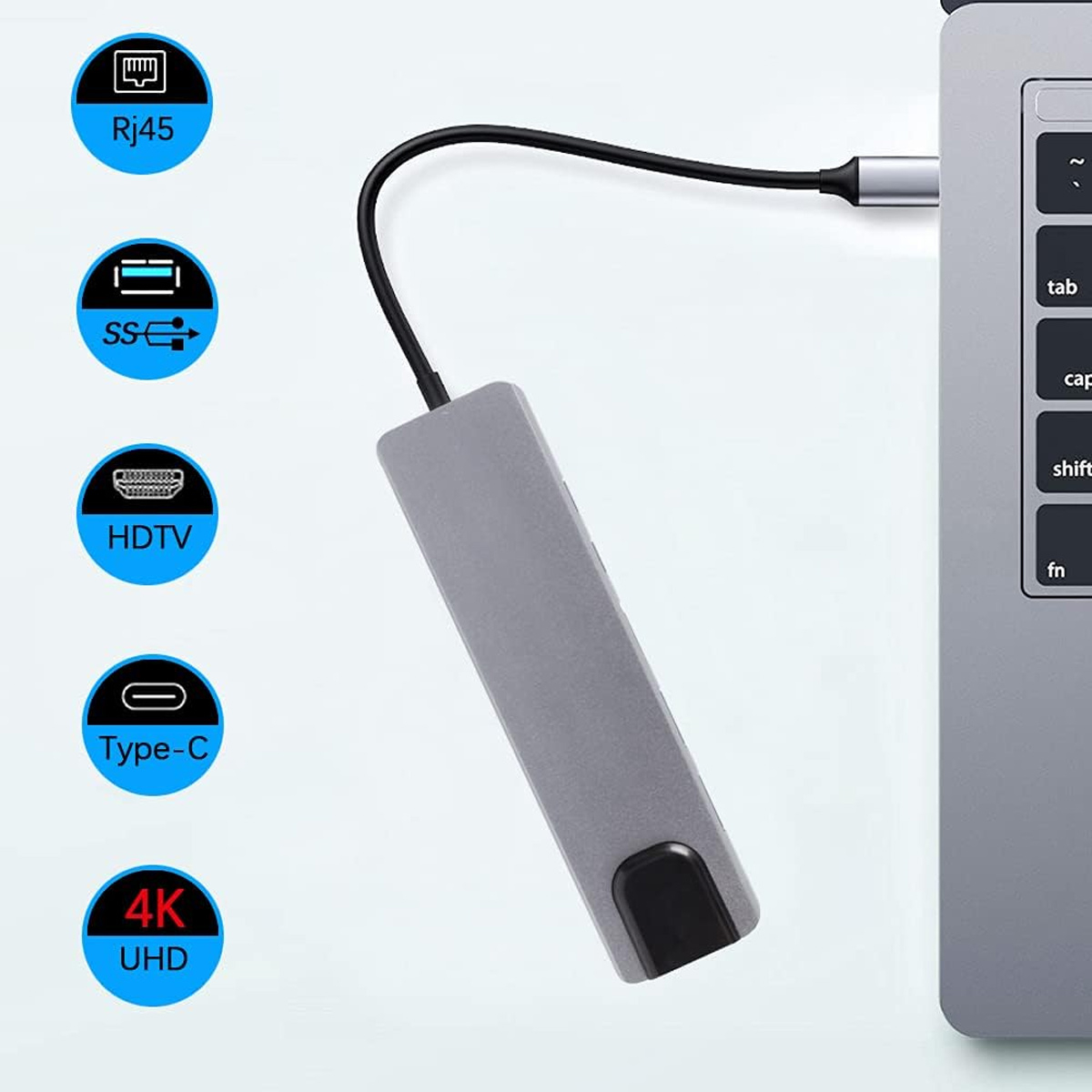 Grauer Hub mit mehreren Anschlüssen, die mit einem Laptop verbunden sind. Symbole für die Anschlüsse sind beschriftet.