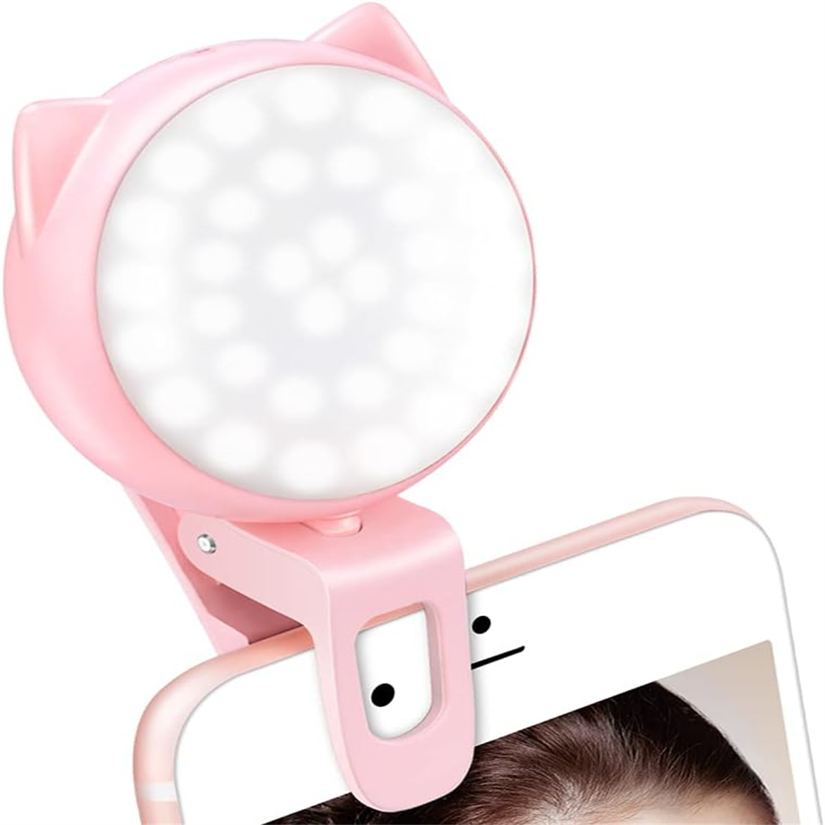 Rosa katzenförmiger Telefonlichtclip, an einem Telefon befestigt. Weißer Hintergrund.