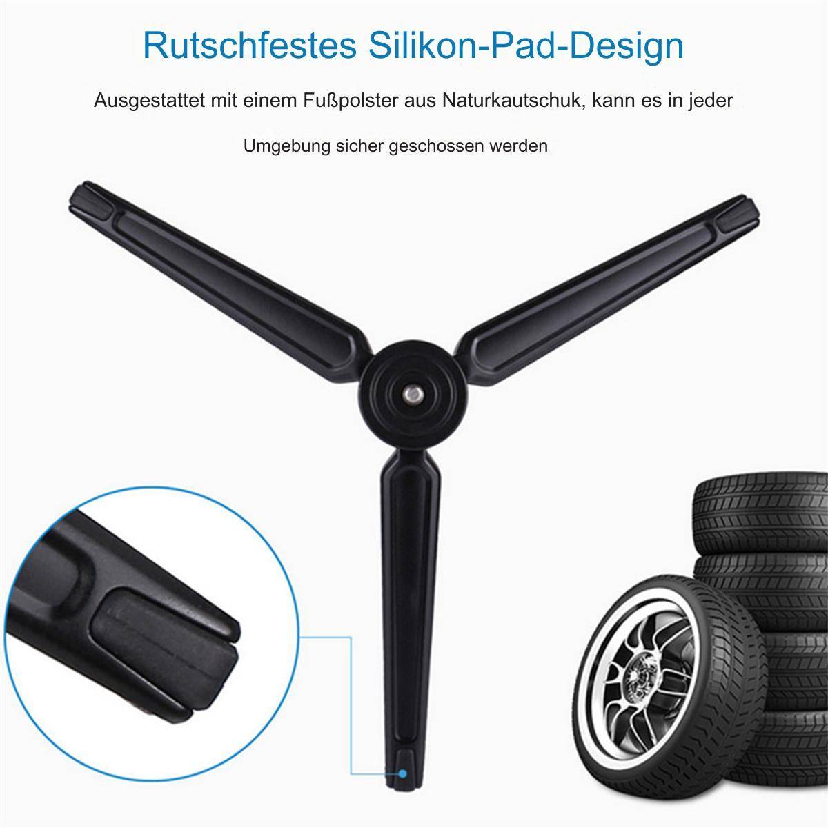 Schwarzes Stativ mit Telefonhalter und Reifen, das ein Silikonpad-Design zeigt.