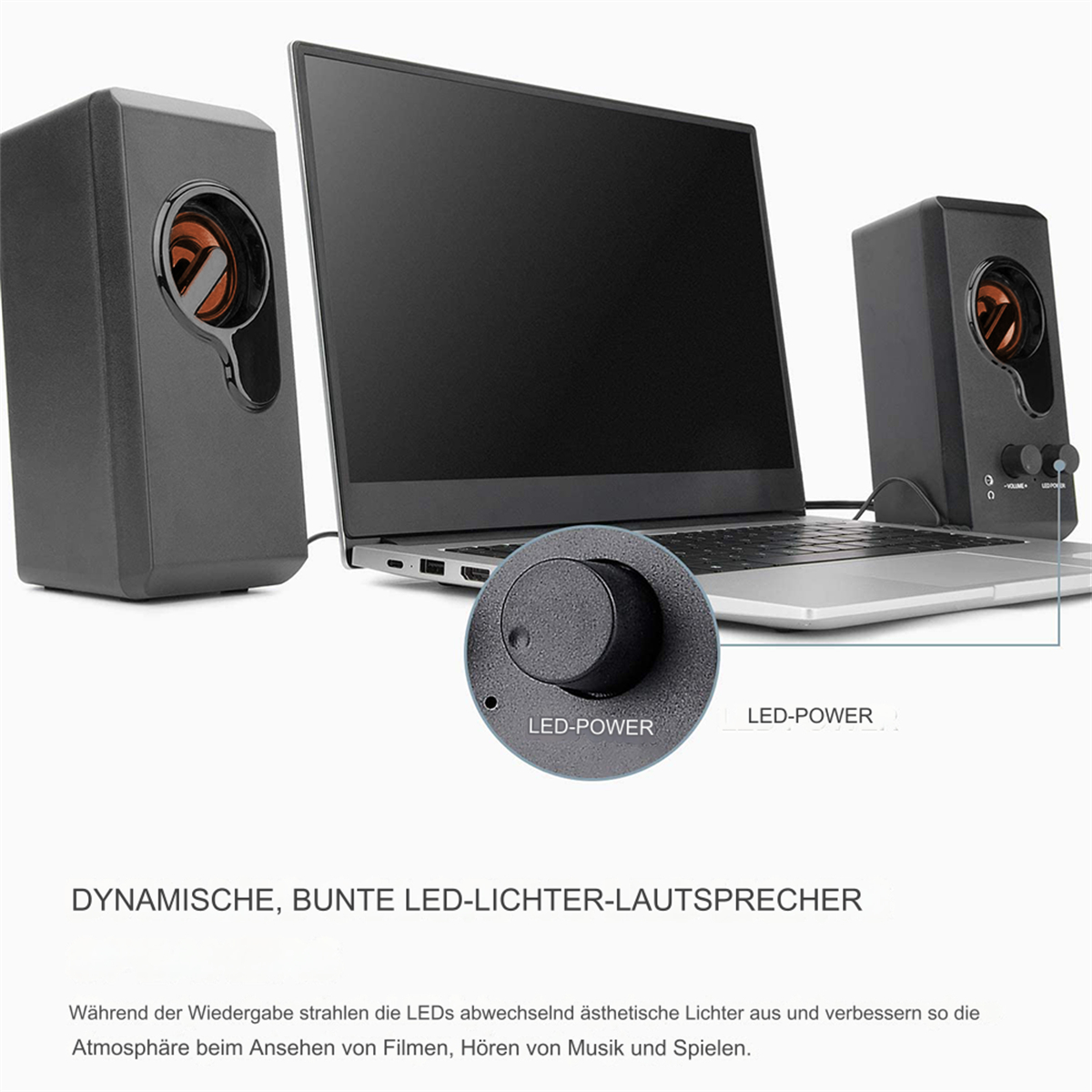 Desktop-Lautsprecher mit LED-Leistungsregelung, an einen Laptop angeschlossen, mit einem schwarzen Steuerungsrad.