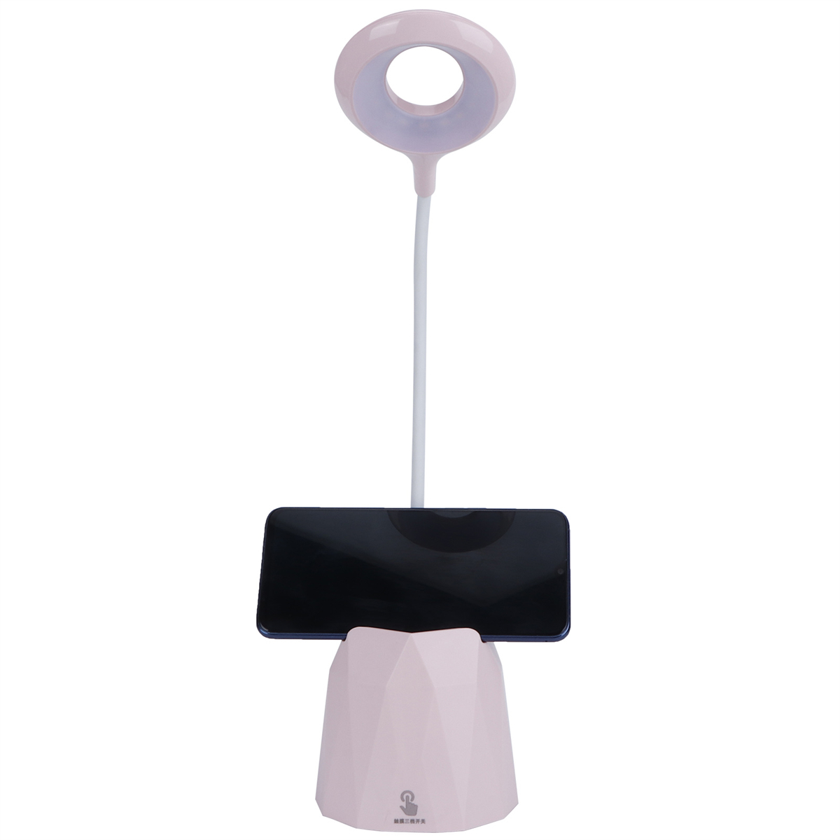 Eine rosa Schreibtischlampe mit Telefonhalterung, zentriert auf weißem Hintergrund.
