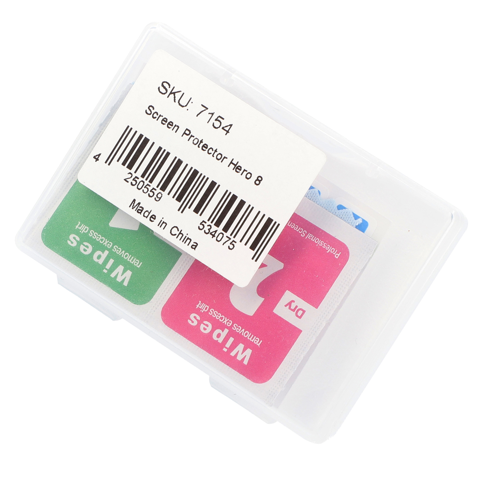 Eine transparente Plastikbox mit zwei kleinen Päckchen: eines grün und eines rosa, mit Etiketten.