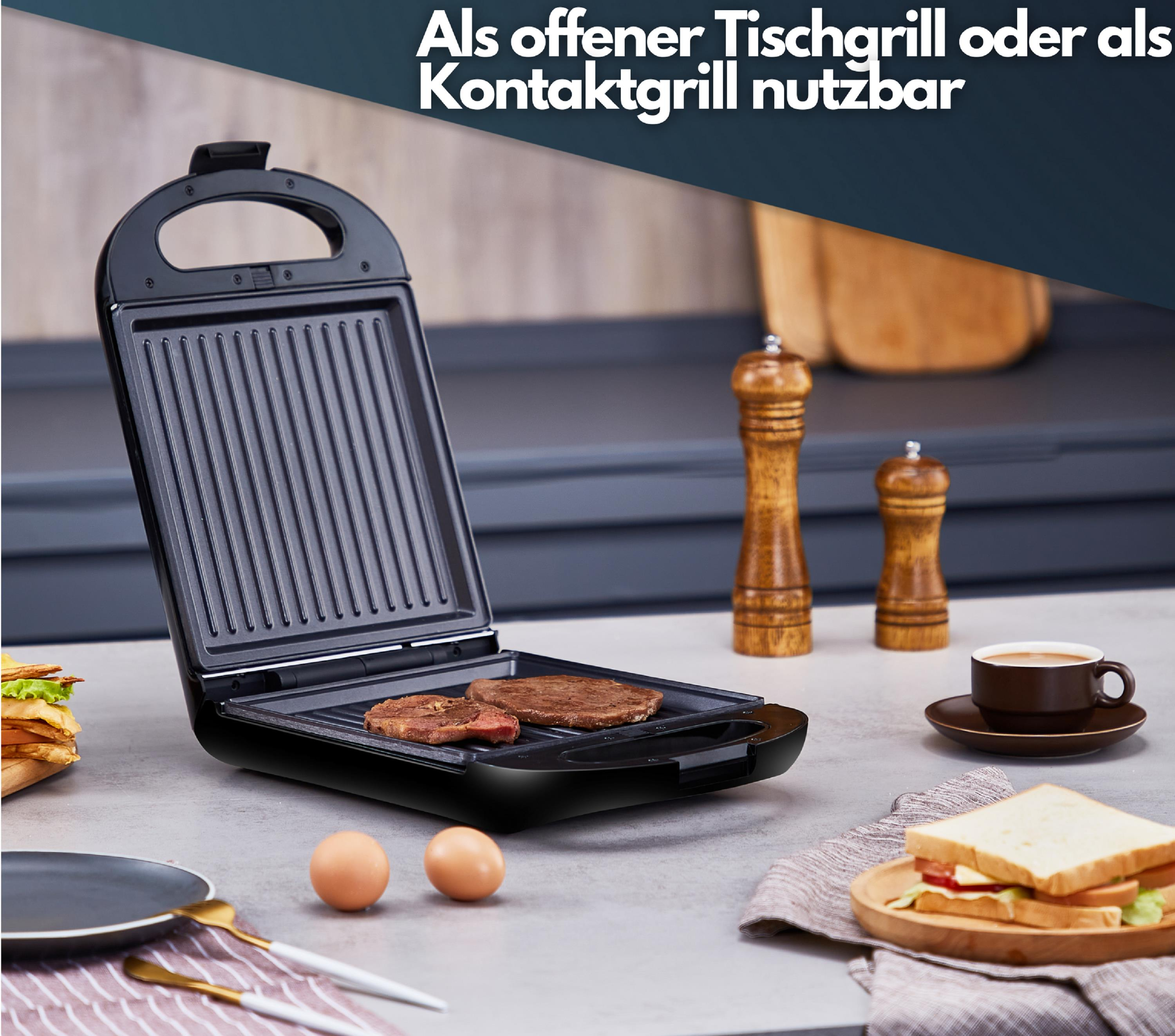 Schwarz-silberner Grill. Zwei Steaks braten. Der Grill ist offen. Andere Gegenstände im Hintergrund.