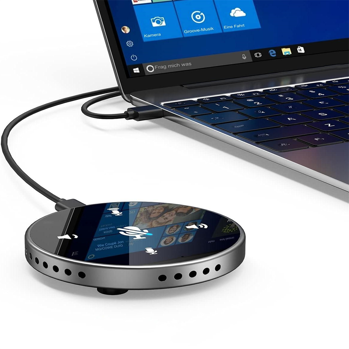 Ein Laptop, verbunden mit einem silbernen Gerät, zeigt einen Bildschirm mit Symbolen.