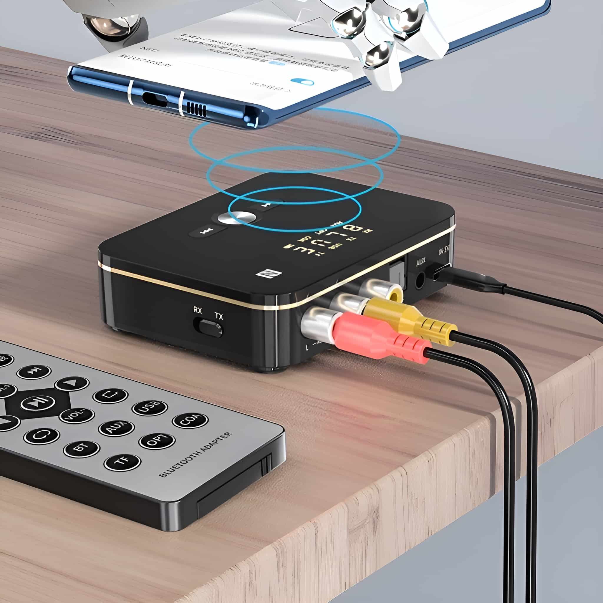 Ein schwarzer Bluetooth-Adapter mit roten, gelben und weißen Kabeln. Eine Fernbedienung und ein Telefon sind ebenfalls sichtbar.