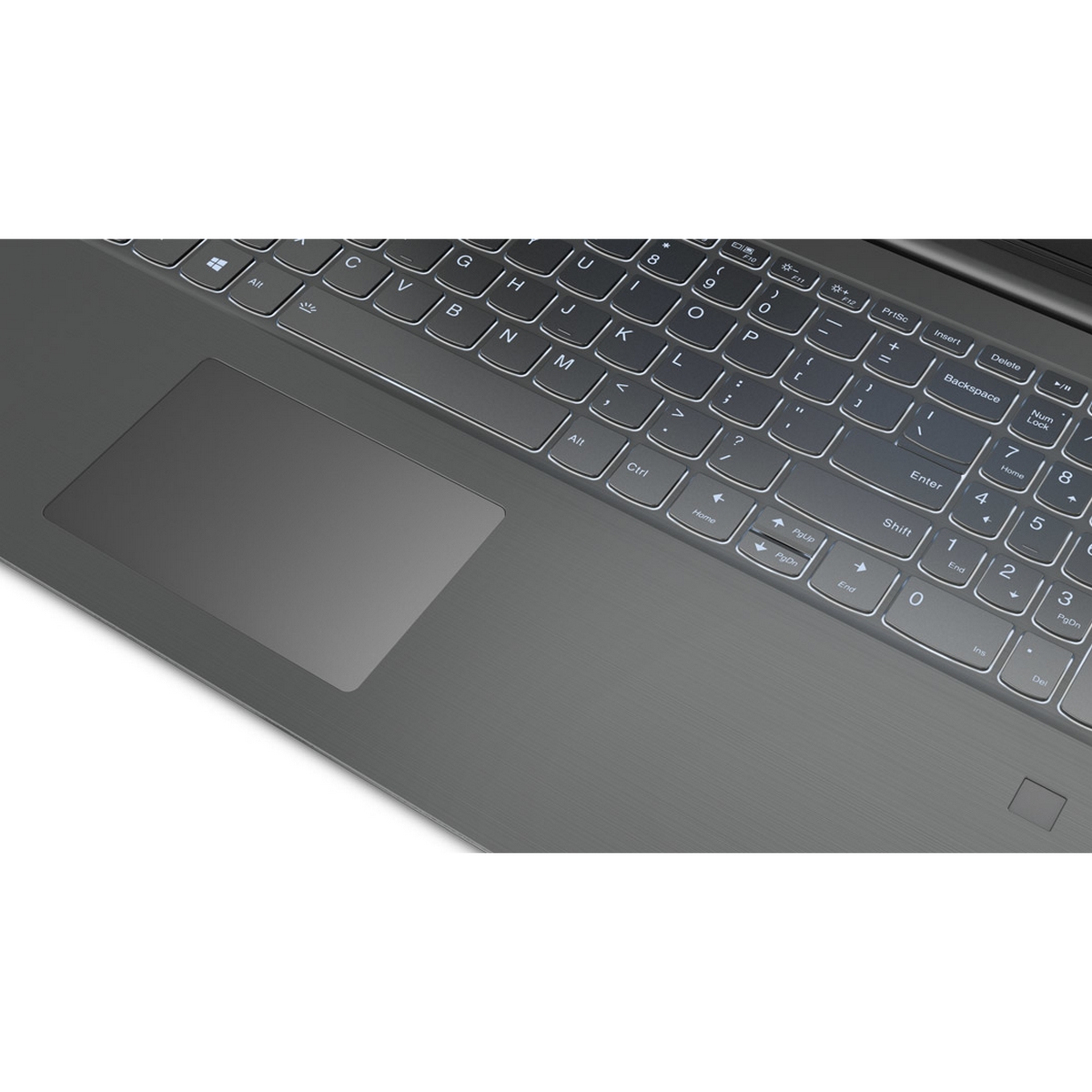 Primo piano della tastiera e del trackpad di un laptop. Tasti bianchi, trackpad grigio scuro.
