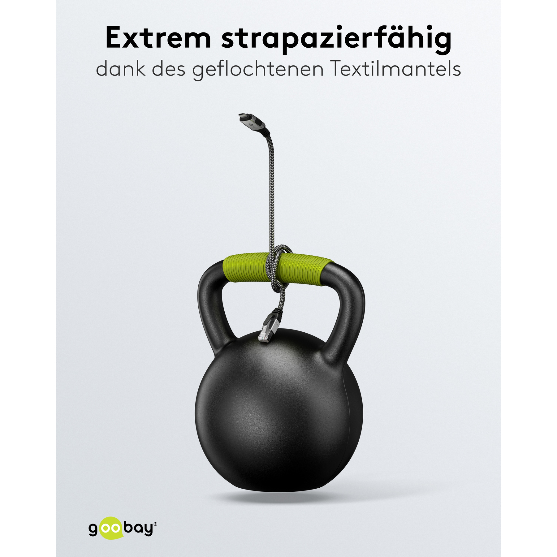 Un kettlebell nero con un'impugnatura verde e un cavo avvolto attorno. Testo nell'immagine.