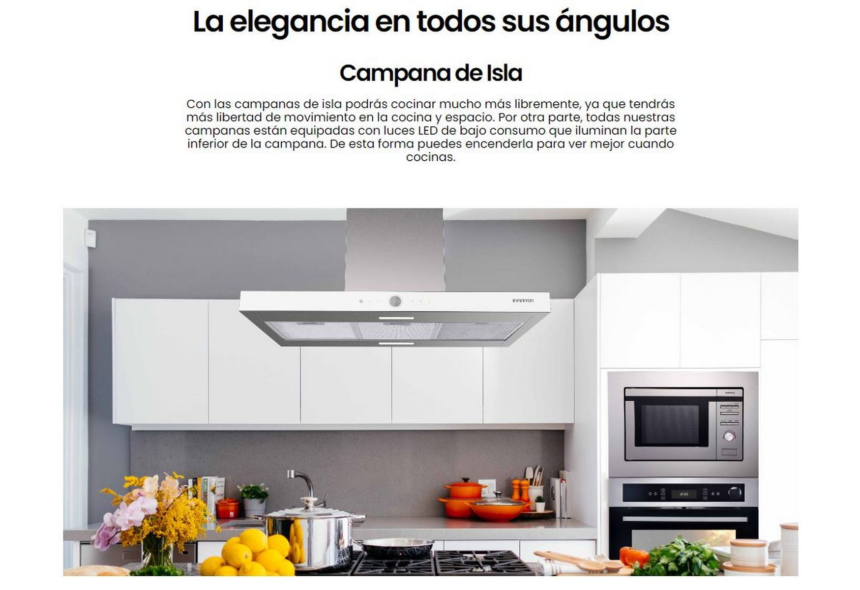 Una cocina blanca con una campana extractora de acero inoxidable, gabinetes blancos y una encimera gris.