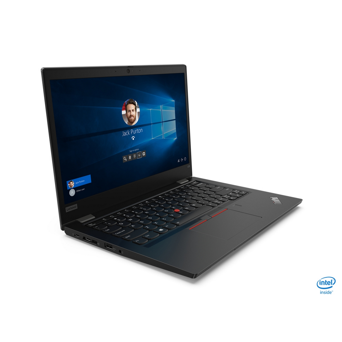 Un laptop nero è aperto, mostra una schermata di accesso. Un volto è mostrato sullo schermo.