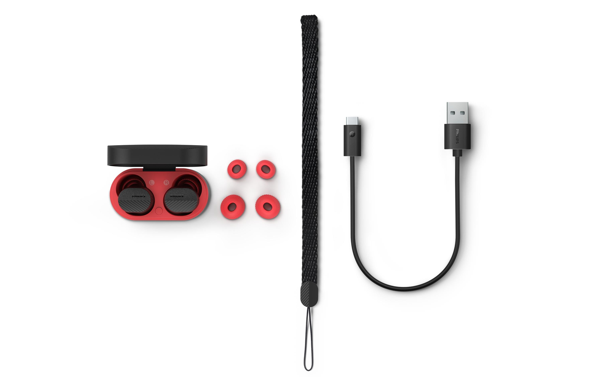 Słuchawki, etui ładujące i kabel USB na białym tle.