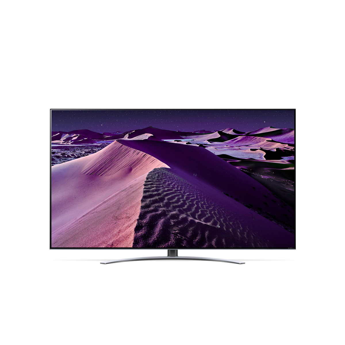 Televisor grande mostrando un paisaje desértico con dunas púrpuras bajo un cielo estrellado.