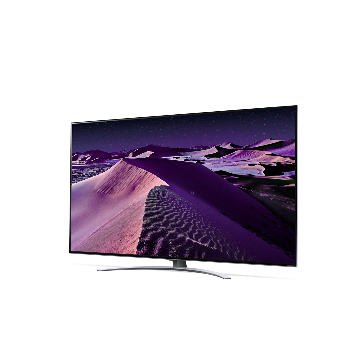 Una pantalla de TV muestra un paisaje desértico con dunas rosadas bajo un cielo nocturno estrellado.