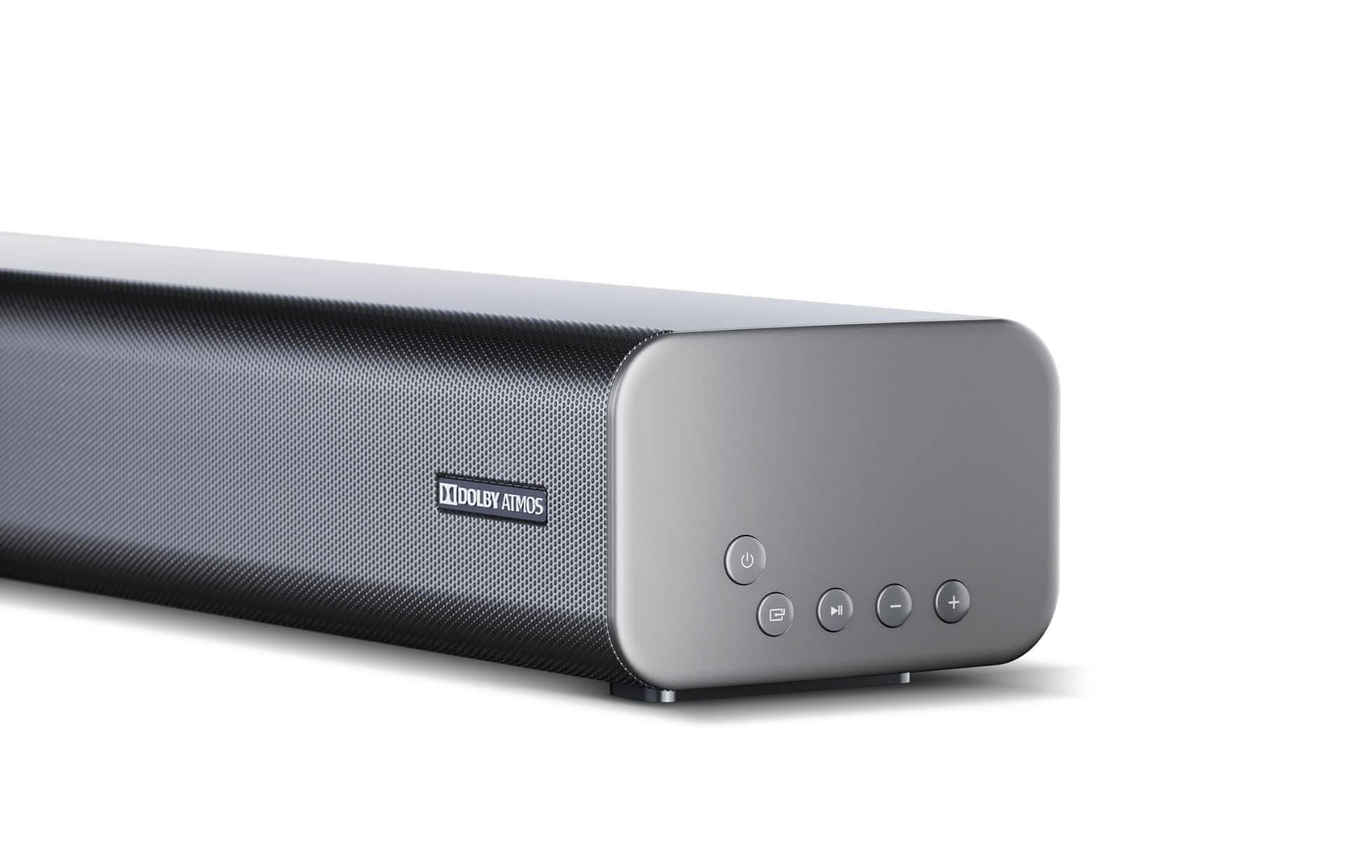 Eine schwarze Soundbar mit silbernen Enden, zeigt Ein- und Aus- und Lautstärketasten, auf Weiß.