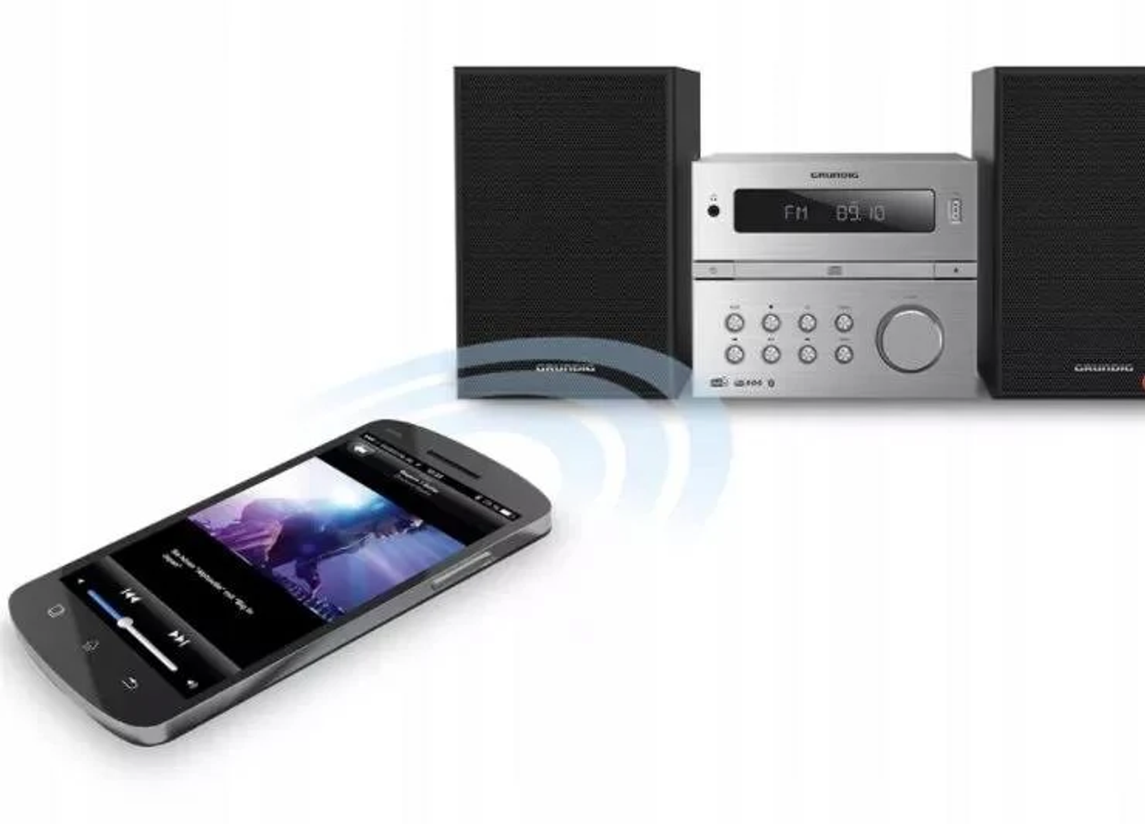 Un sistema estéreo Grundig con un teléfono conectado por Bluetooth. La música se reproduce.