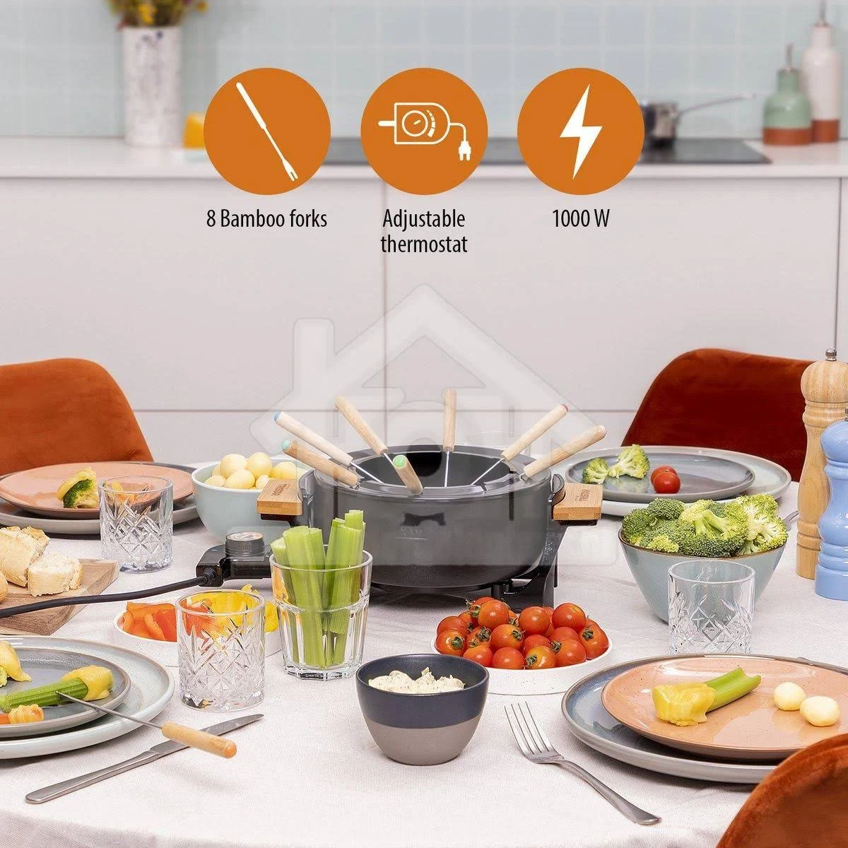 Un juego de fondue en una mesa con alimentos. Incluye tenedores, termostato y 1000W.