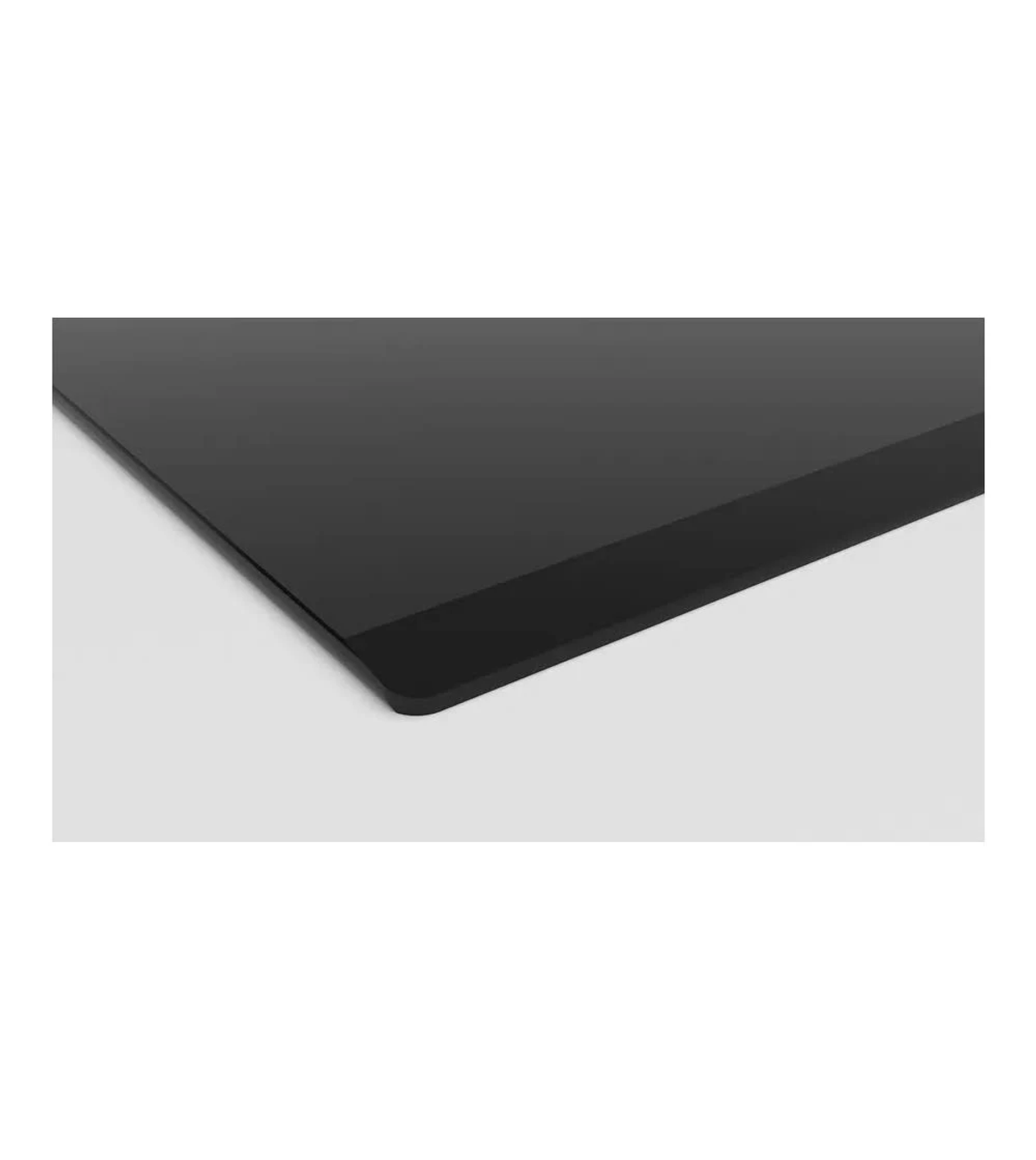 Primer plano de una superficie negra, con una esquina redondeada y un borde negro.
