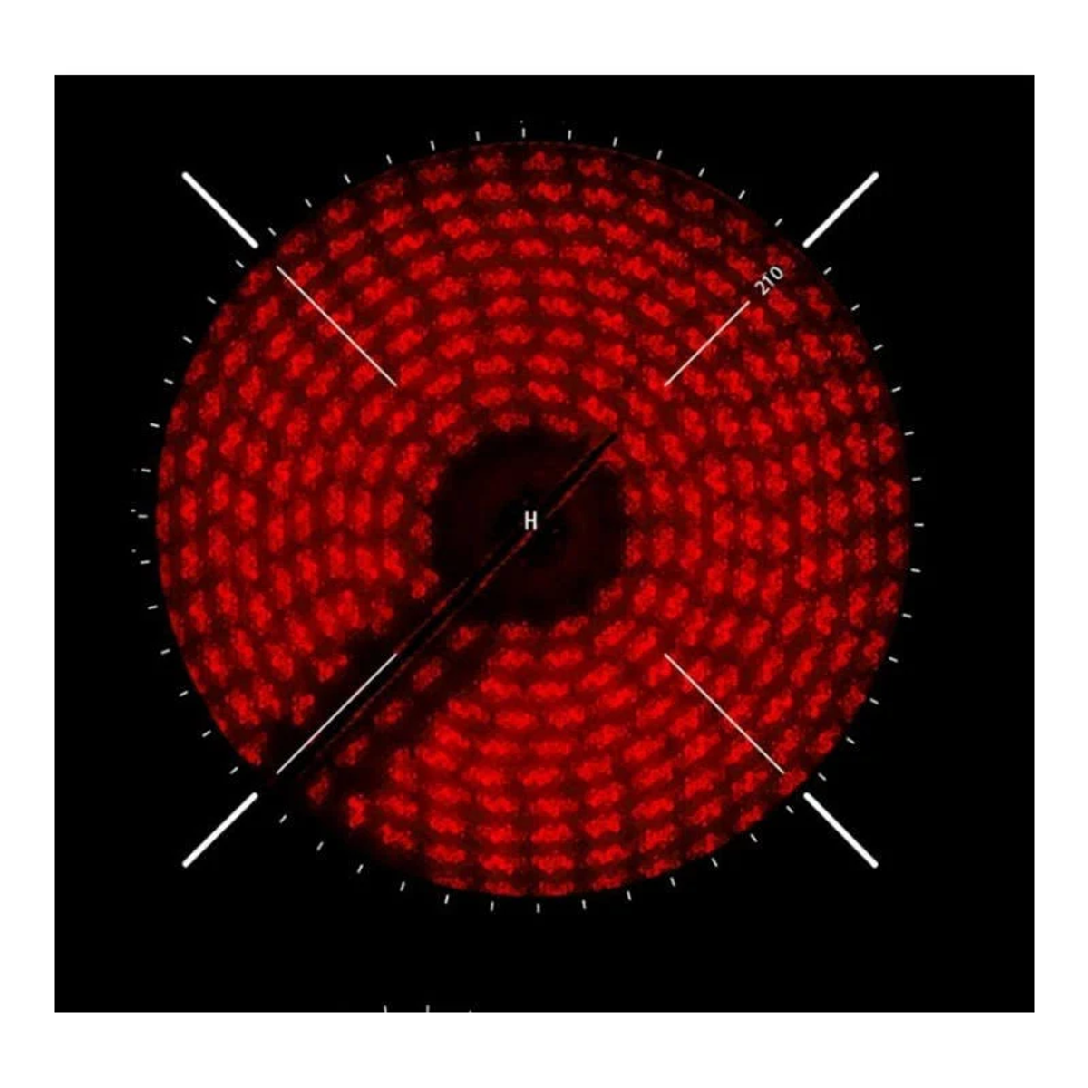 Czerwony, świecący palnik kuchenki elektrycznej z białymi oznaczeniami na czarnej powierzchni.