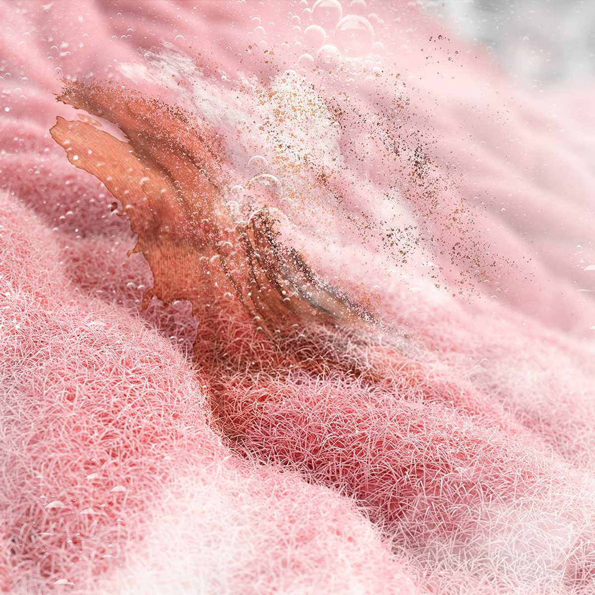 Immagine astratta di tessuto rosa con bolle d'acqua e un elemento in legno.