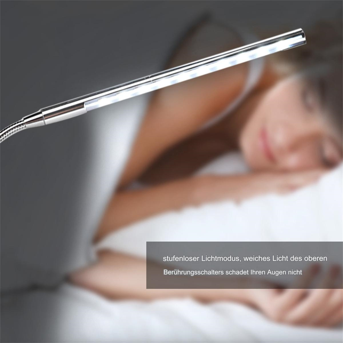Eine silberne LED-Lampe beleuchtet eine schlafende Person.