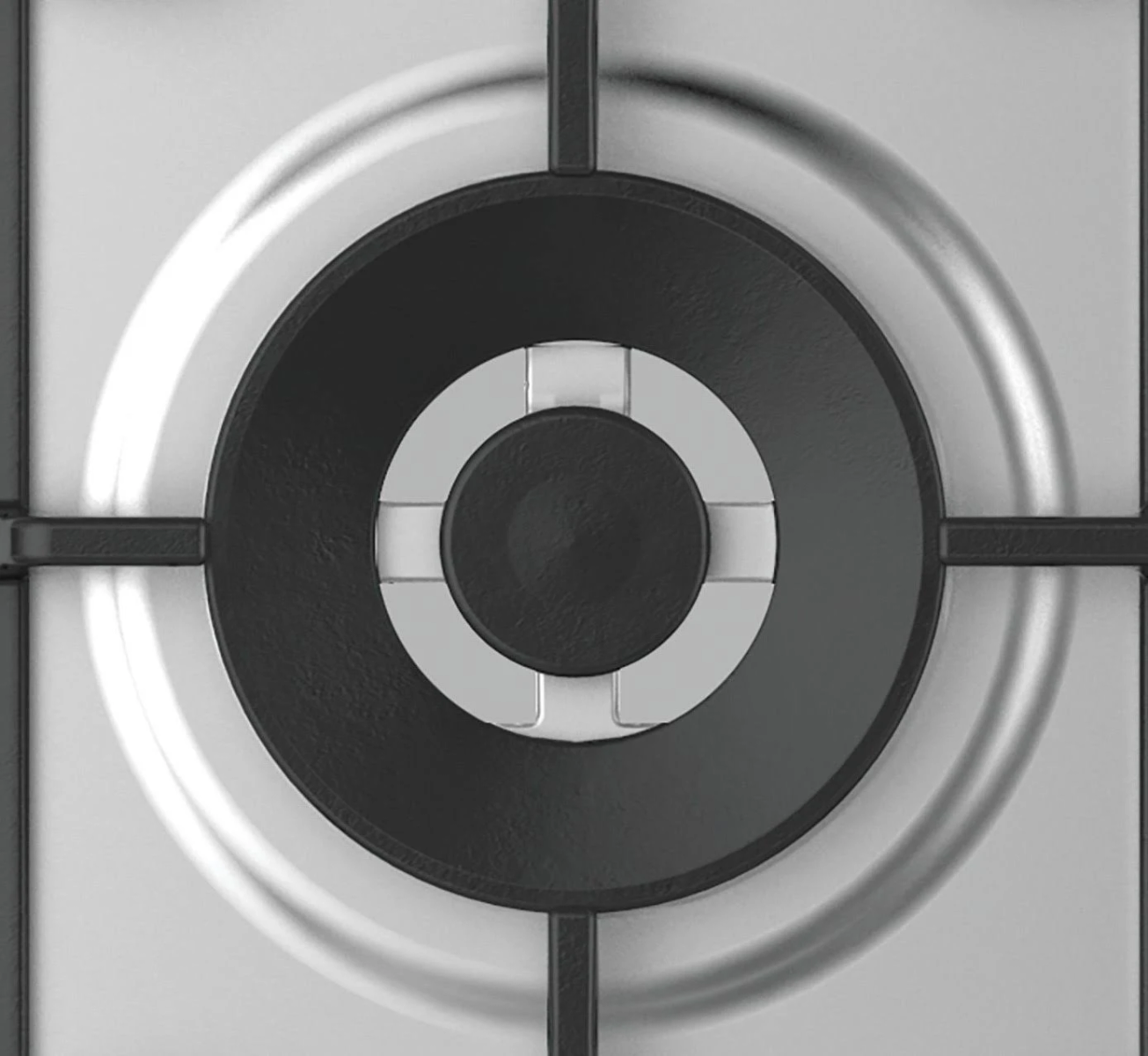 Zbliżenie palnika kuchenki gazowej, pokazujące palnik i czarne podpory krzyżowe.