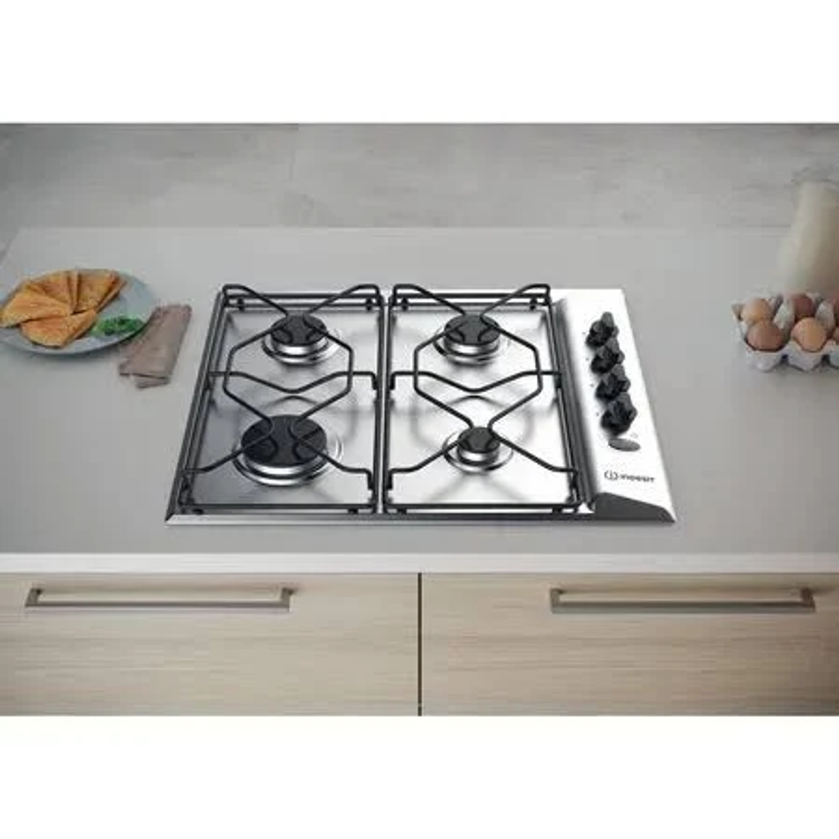 Płyta gazowa z czterema palnikami. Powierzchnia ze stali nierdzewnej. Pokrętła po prawej.