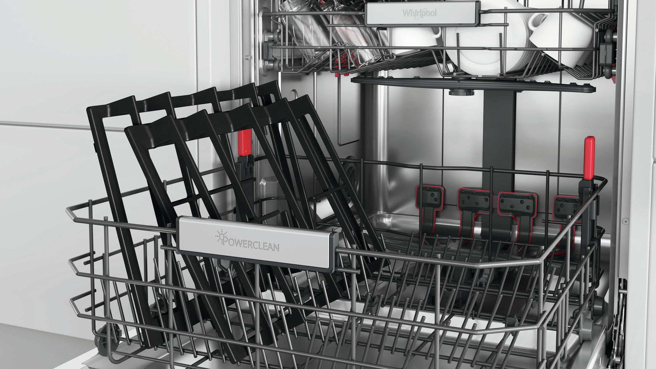 Interno di una lavastoviglie, con cestelli e il logo Whirlpool.