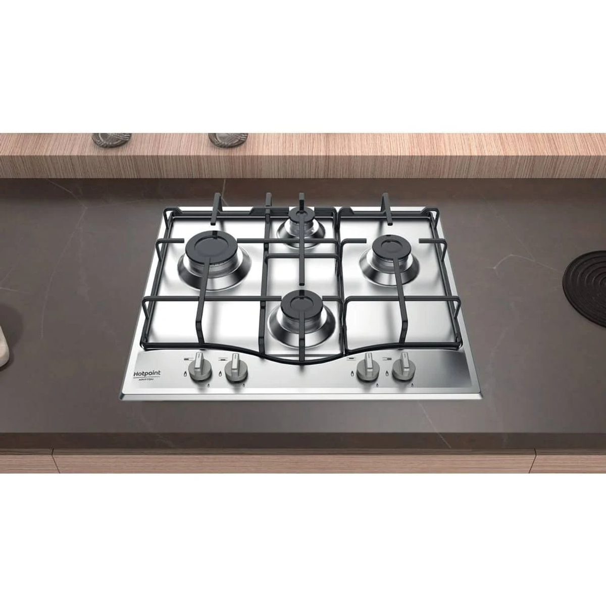 Płyta grzewcza ze stali nierdzewnej z czterema palnikami, pokrętłami i czarną powierzchnią.