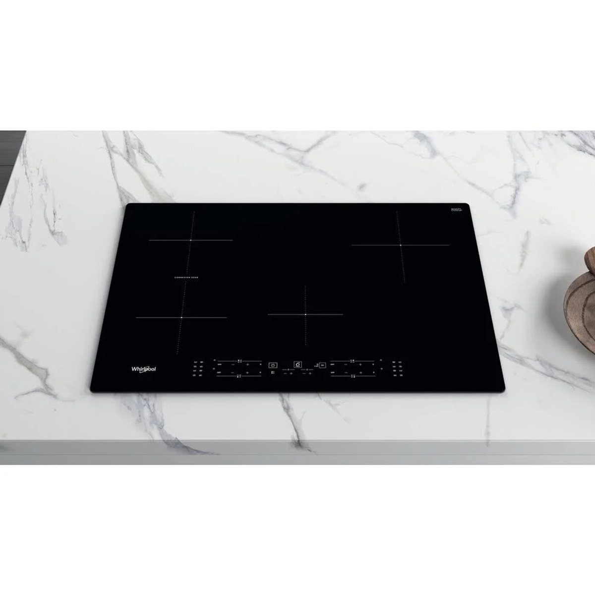 Czarna płyta indukcyjna zainstalowana na białym blacie.