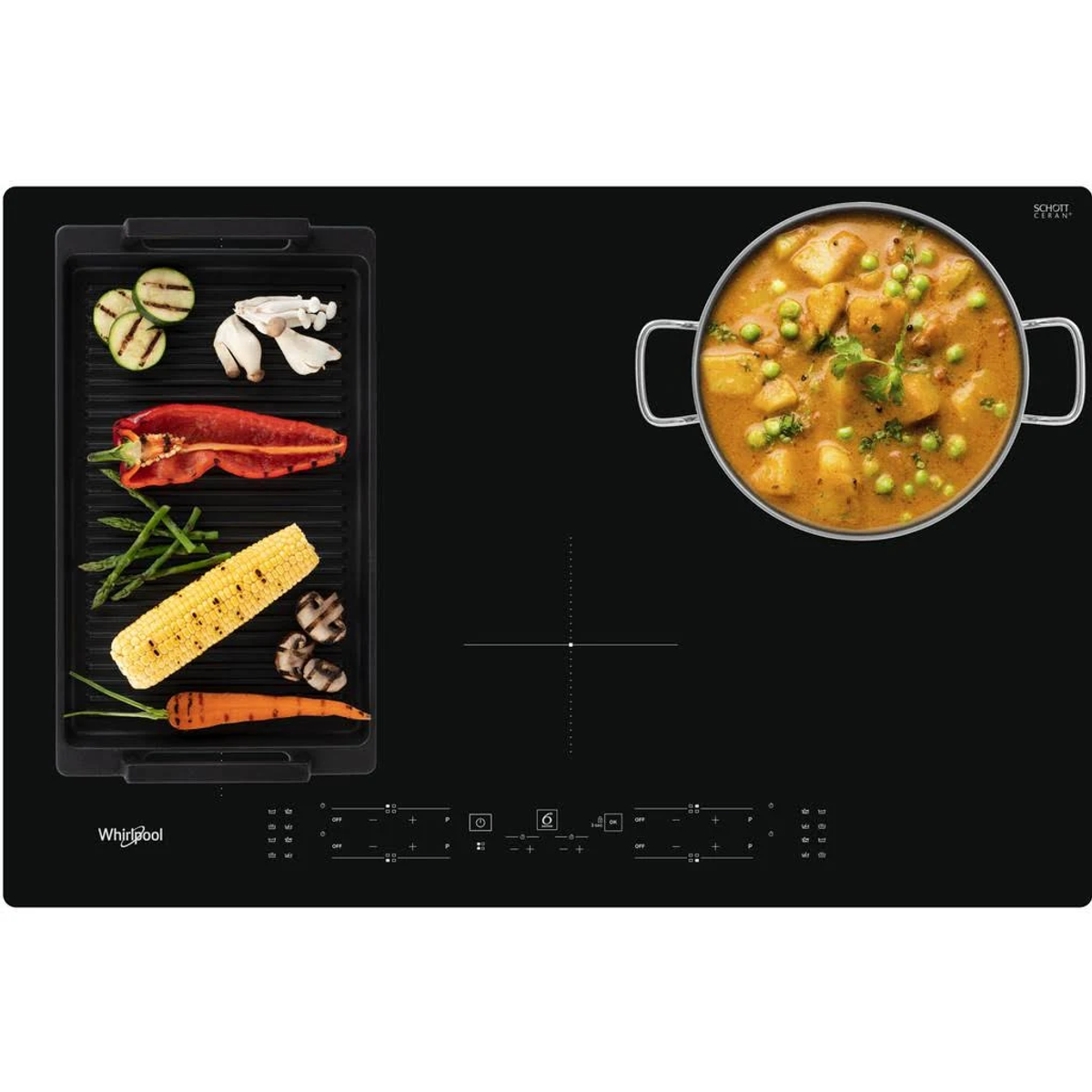 Czarna płyta indukcyjna z warzywami i curry. Logo Whirlpool. Kukurydza, papryka, marchew.