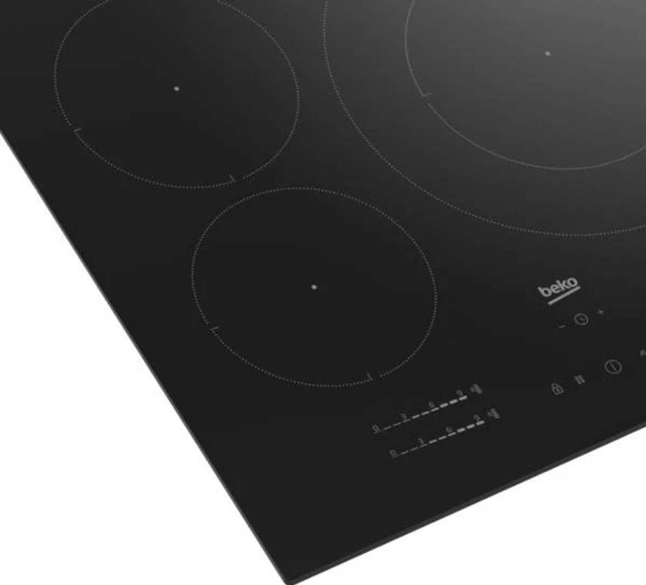 Primer plano de una placa negra con cuatro zonas de cocción circulares. El logotipo de Beko es visible.