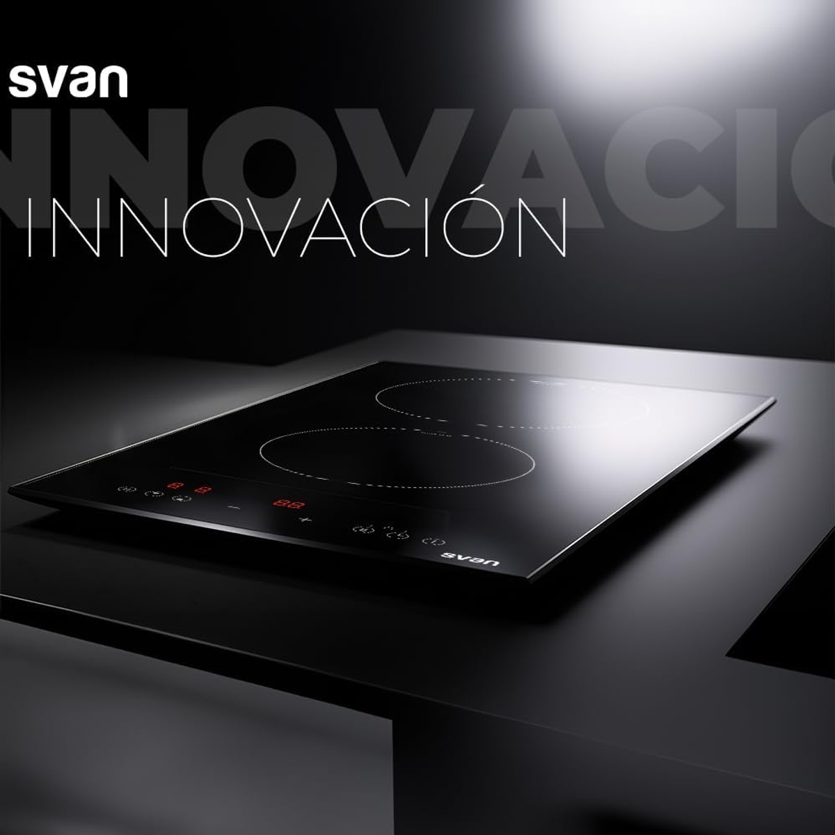 Una placa negra con dos zonas de cocción, pantalla digital y la marca 'svan'.