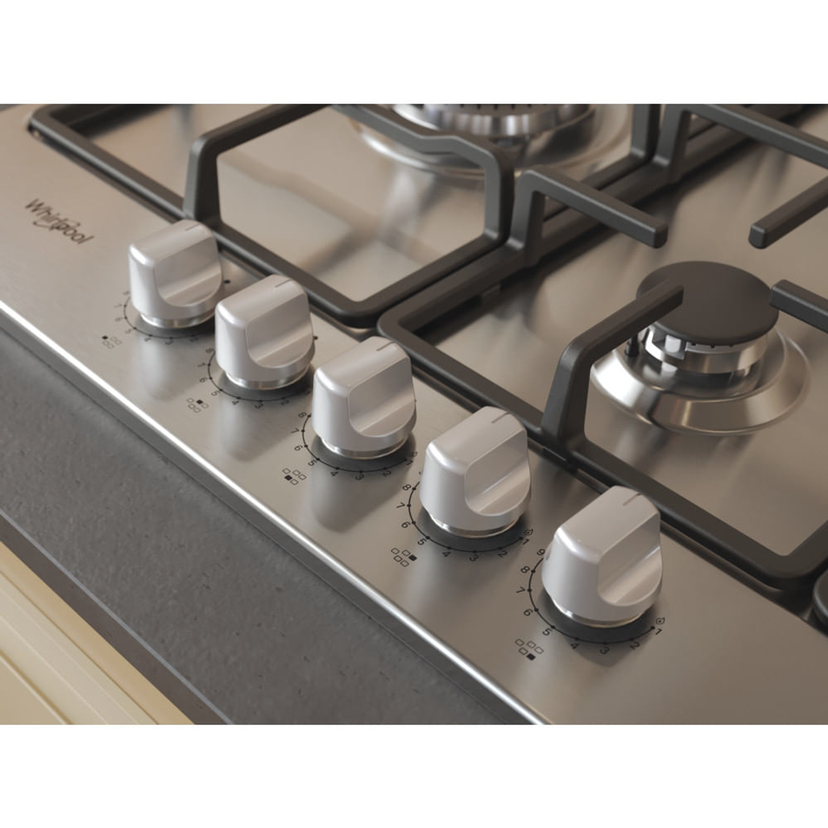 Zbliżenie gazowej płyty grzewczej ze stali nierdzewnej z pokrętłami.