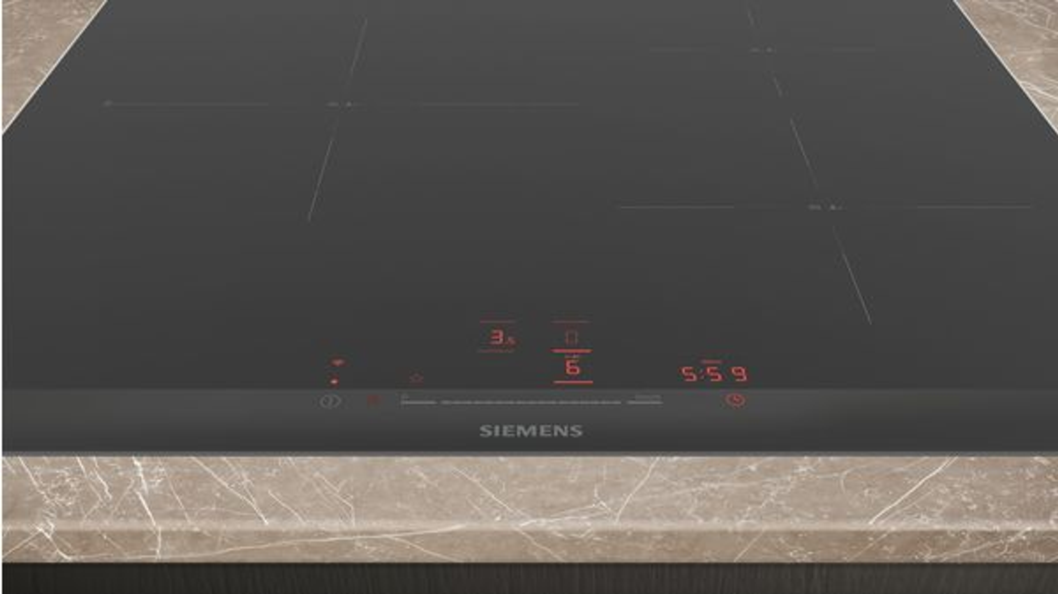 Placa de inducción Siemens negra con pantallas rojas, sobre encimera marrón claro.